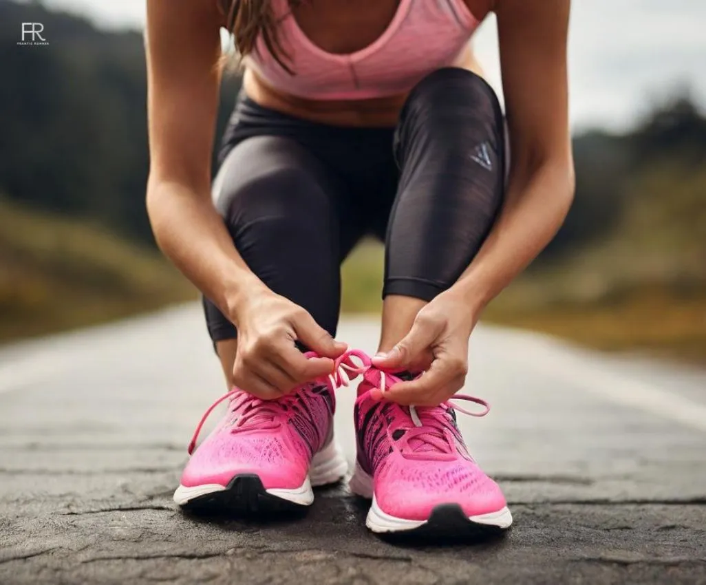 a female runner tie up her laces while running thinking about should you run without socks