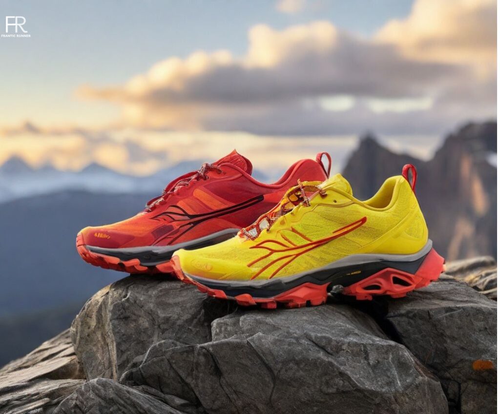 an image of two vibrant ugly running shoes, one in yellow & other in red color, laying on the top of the rocky mountain